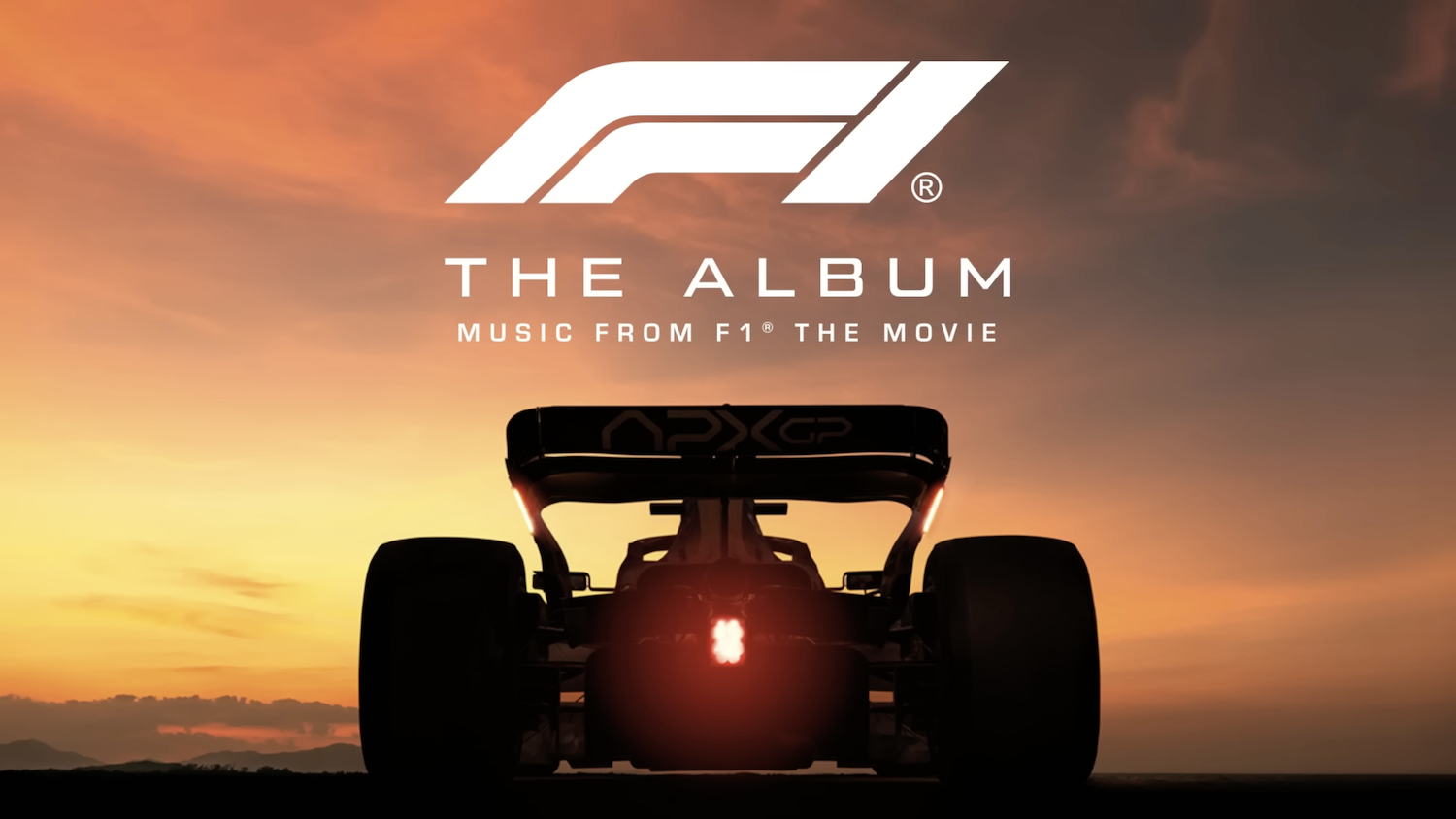 A Formula 1 car's rear is silhouetted against a sunset, with ‘F1 The Album: Music From F1 The Movie’ text for the movie soundtrack.